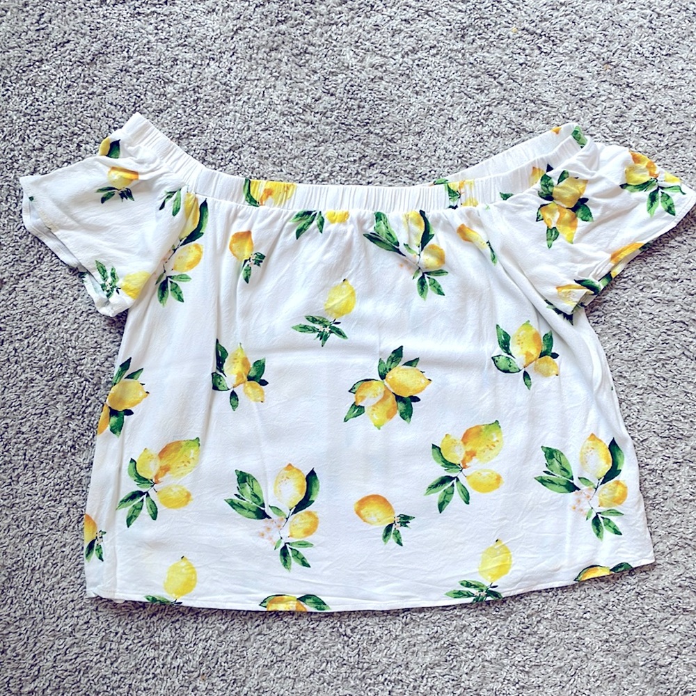 Fresh and adorable off the shoulder “lemon” shirt.